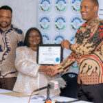 President Minja presents Membership certificate to Voice of Disabled Women.